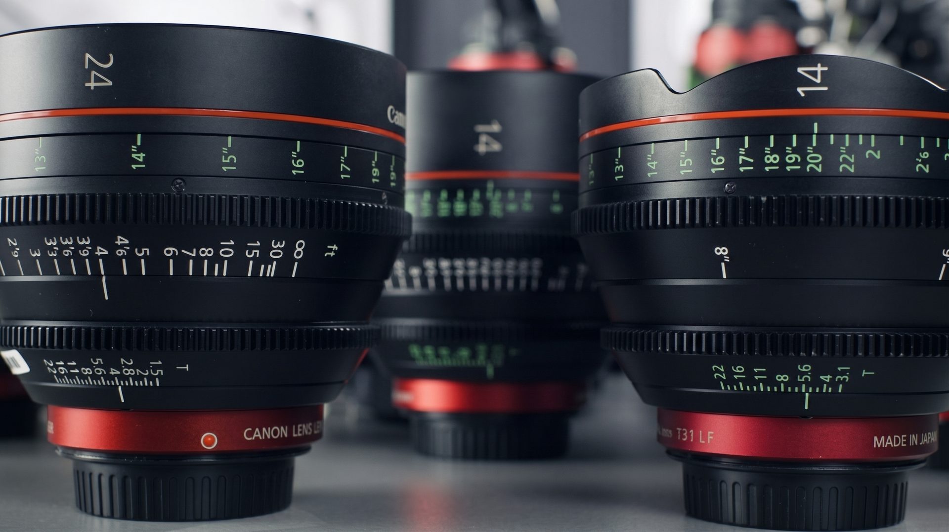 Cinema prime lenses on set, focus and aperture markings visible.
